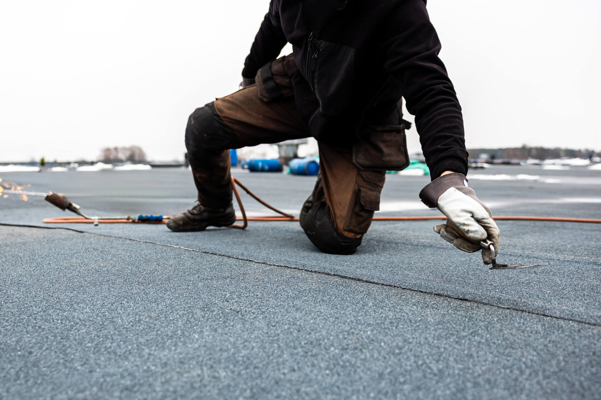 Storm-damaged asphalt shingle roof with hail impact and wind damage in Calgary