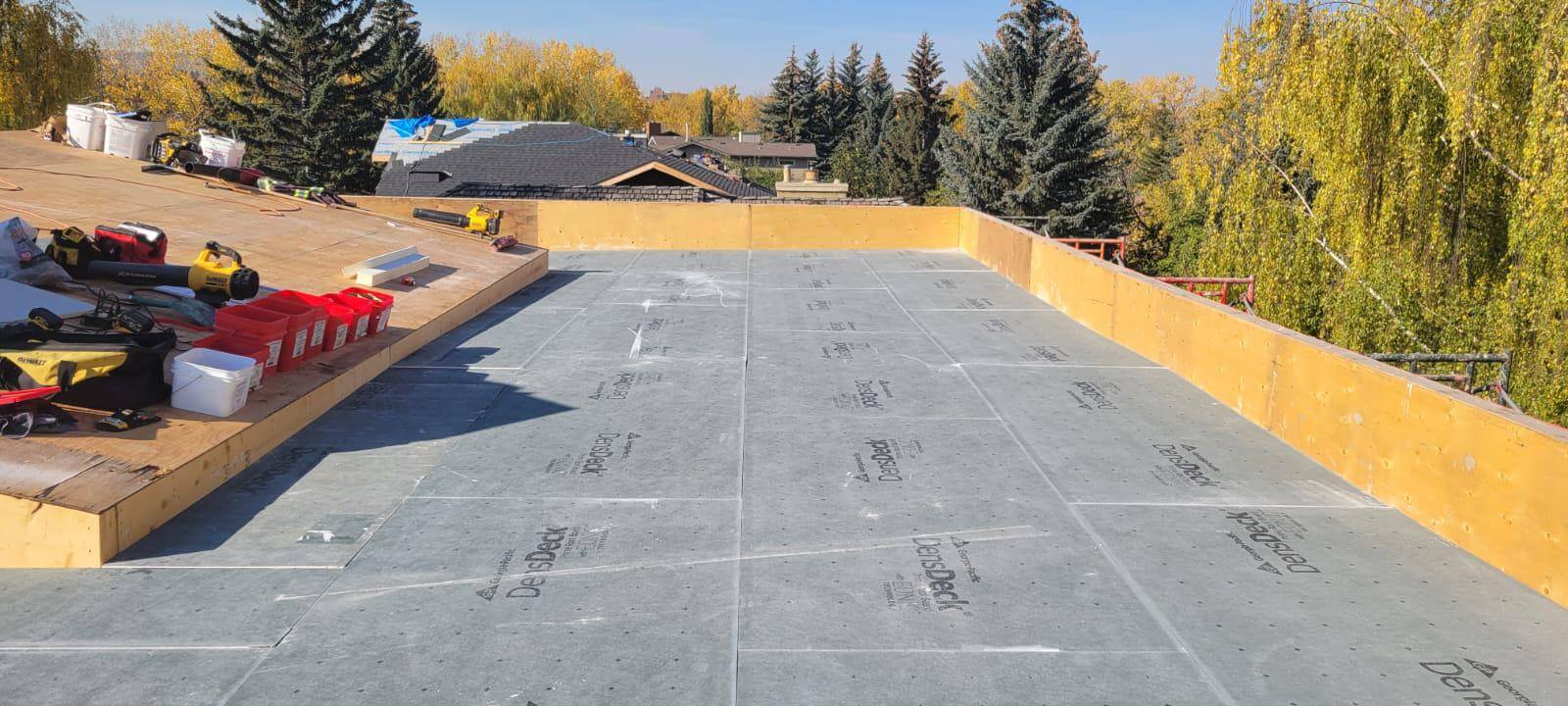 New EPDM rubber roof installation with seamless membrane on a Calgary building