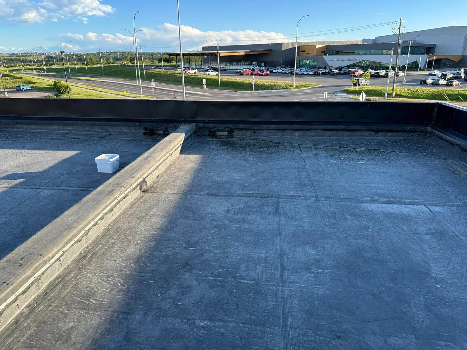 Full EPDM rubber roof replacement with new membrane being installed in Calgary