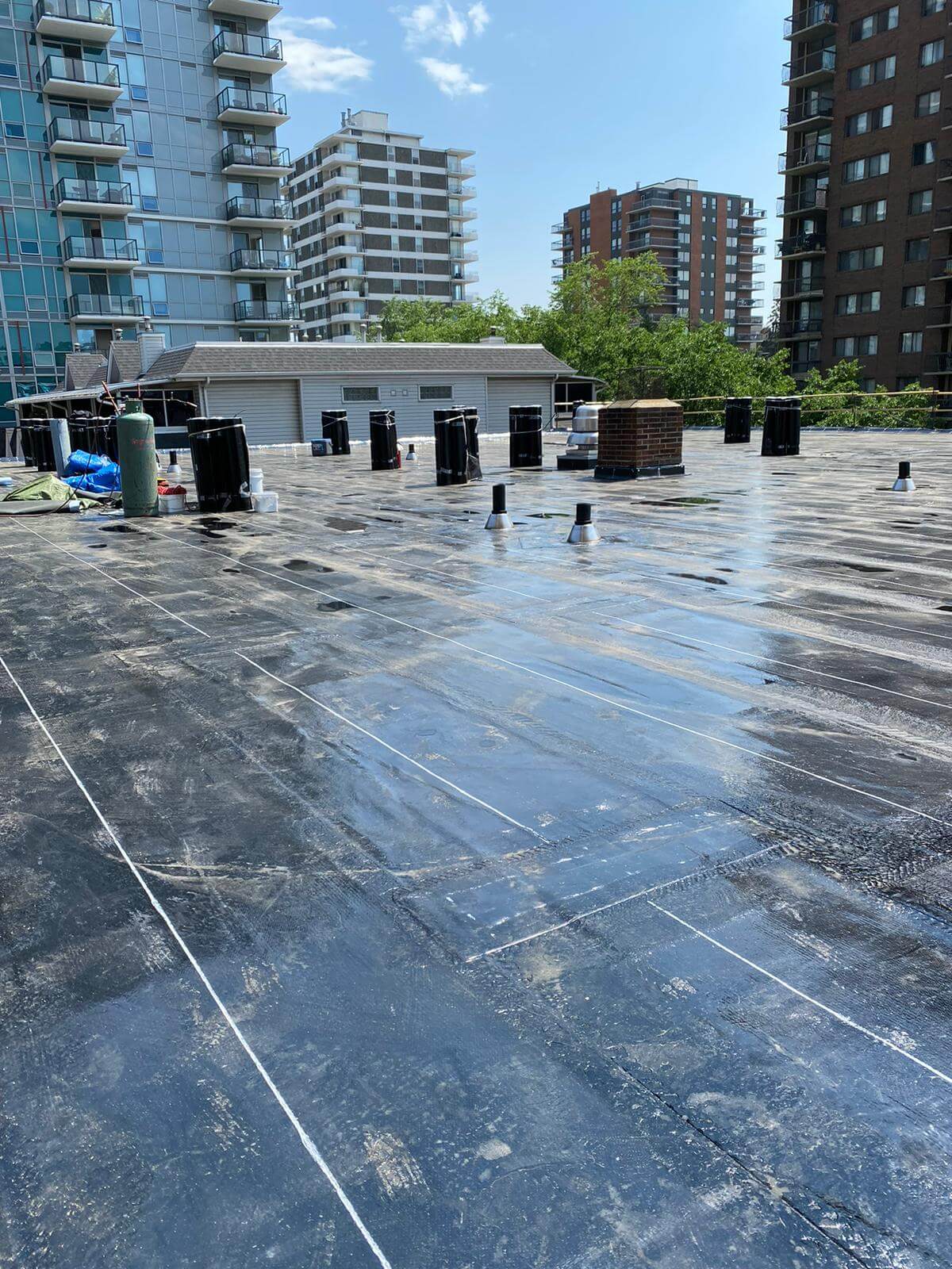Flat roof showing signs of water damage and membrane wear requiring leak repair