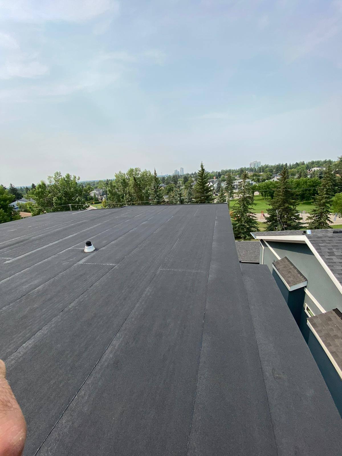 Residential flat roof on a Calgary home with properly sealed membrane and flashings