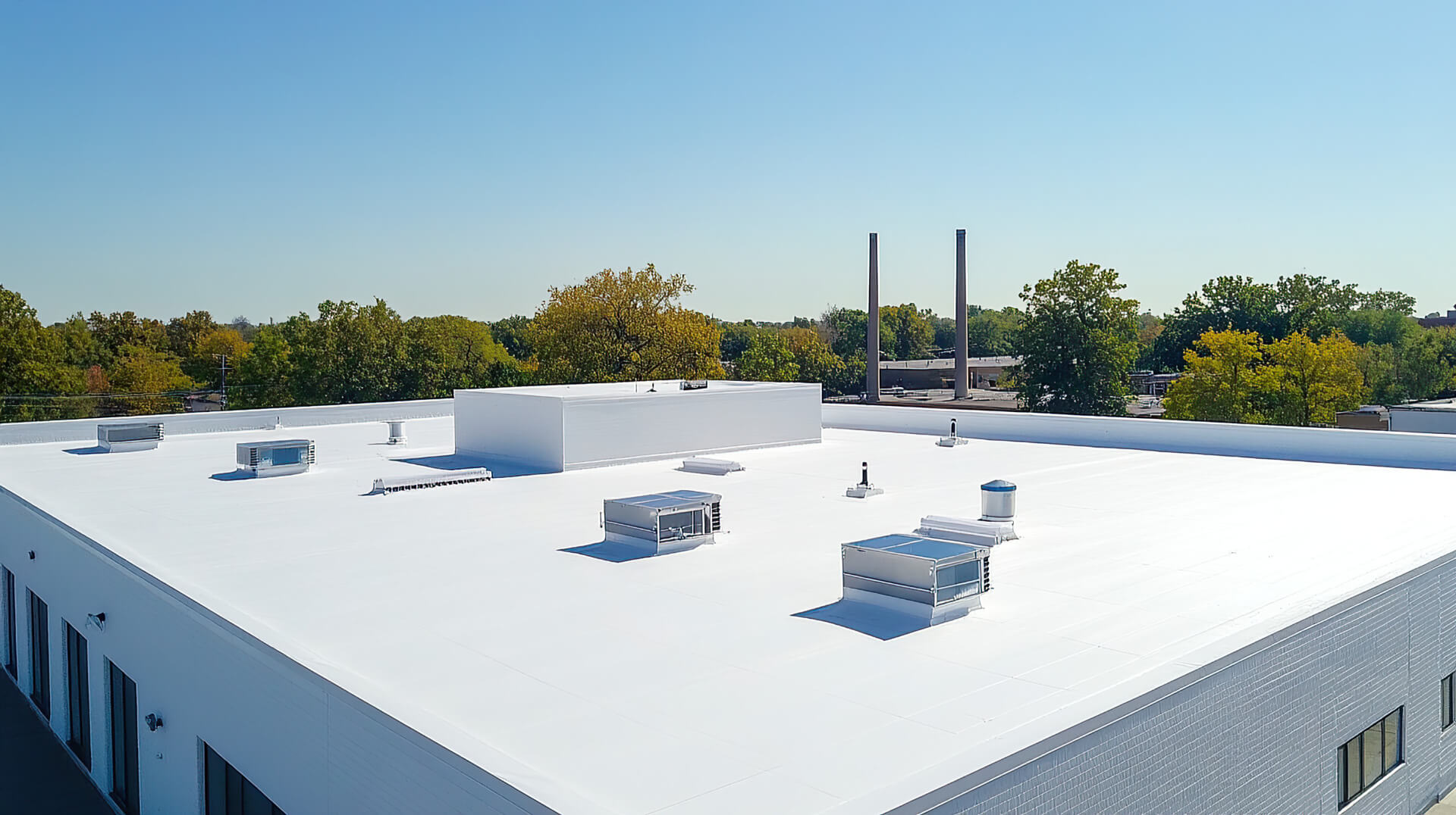 TPO thermoplastic roofing membrane with heat-welded seams on a commercial flat roof